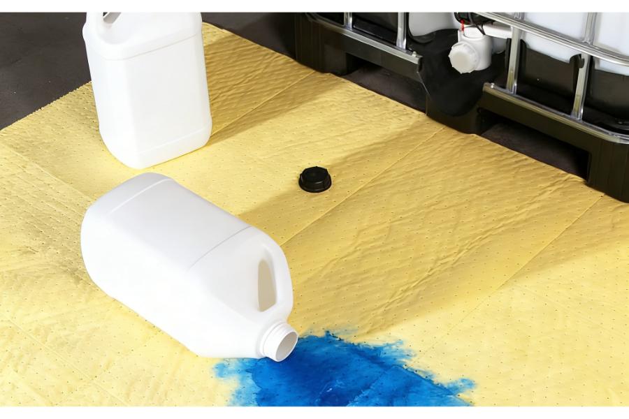 Absorbent pads for hazardous liquid spills